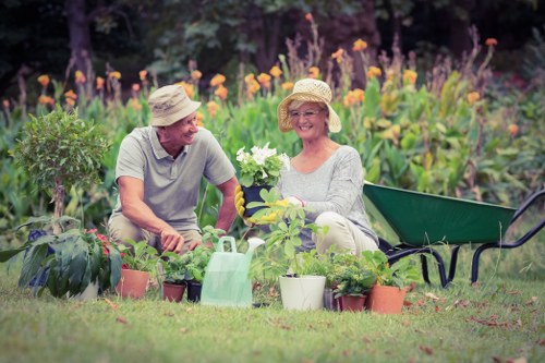 Gardening operative using protective equipment during routine maintenance